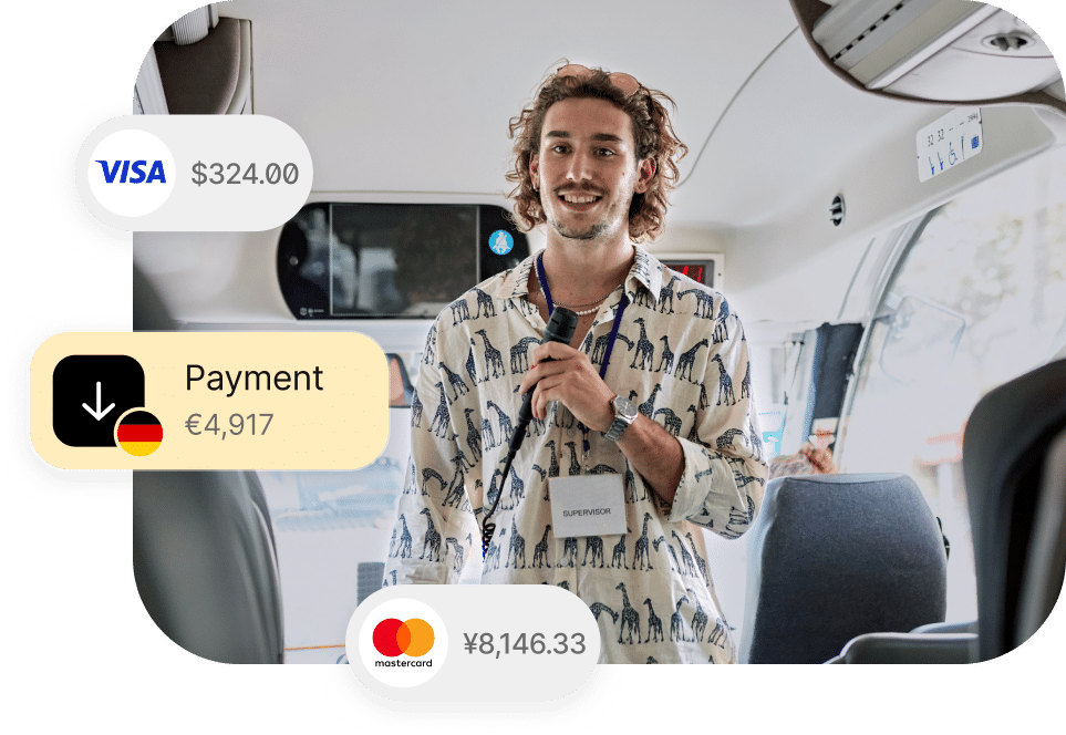 A person standing inside a bus wearing a giraffe-patterned shirt, holding a microphone. Various payment amounts in USD, EUR, and JPY with corresponding card logos are overlaid on the image.